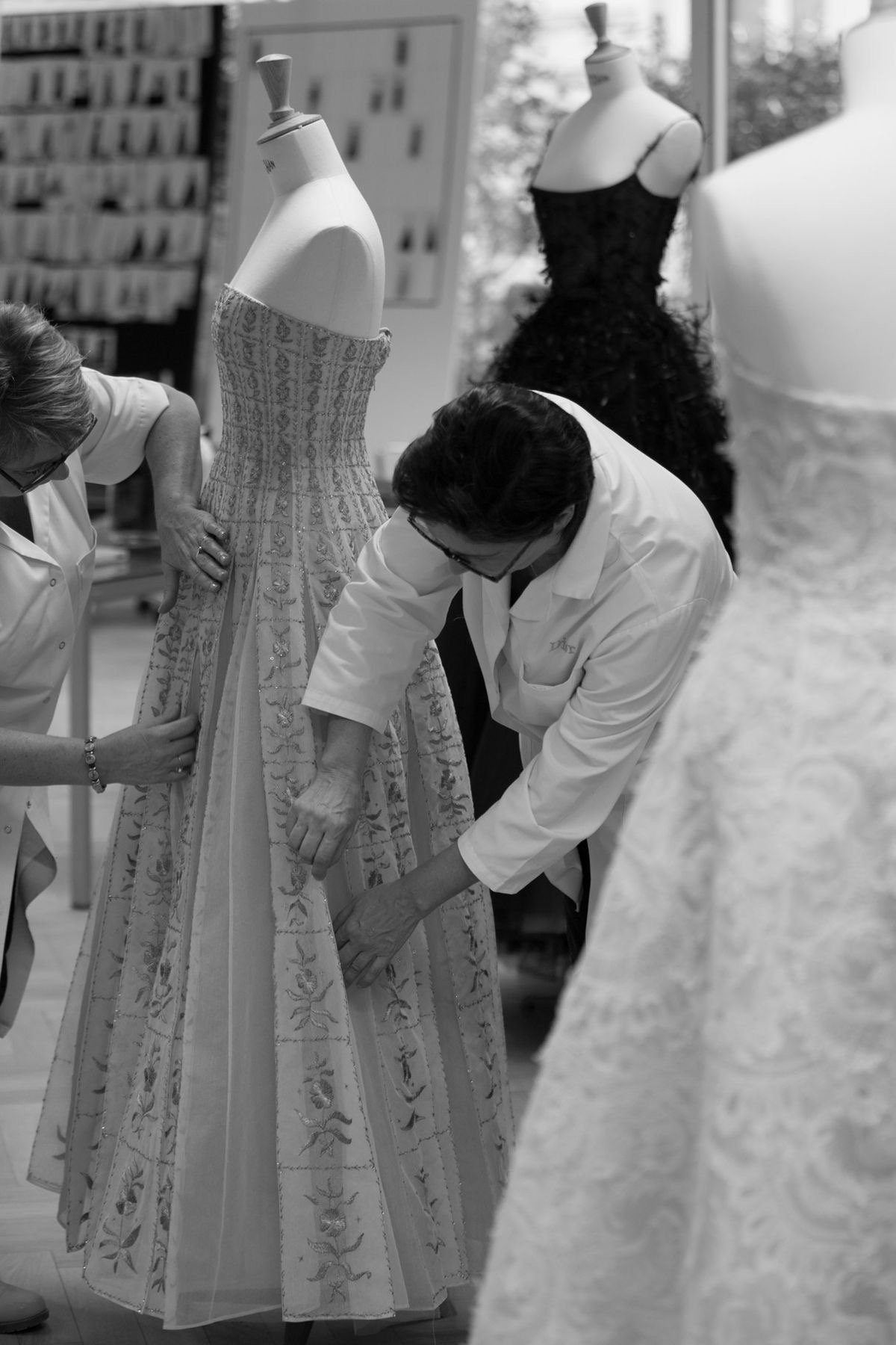Couture wedding dress fitting in an atelier for destination wedding wardrobe management